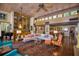 Spacious living room featuring unique wood ceilings, custom built-ins, and terra cotta tile flooring at 320 Mary Jess Rd, Orlando, FL 32839