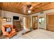 Bright main bedroom featuring a wood ceiling, seating area, and ensuite bathroom at 320 Mary Jess Rd, Orlando, FL 32839