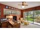 Comfortable home office featuring a modern desk setup, natural light, and serene backyard views at 320 Mary Jess Rd, Orlando, FL 32839
