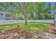 Well-maintained backyard with lush green grass, a privacy fence, and mature trees at 353 Meadow Beauty Ter, Sanford, FL 32771