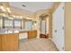 Large bathroom featuring dual sinks, large mirror, tile floor and crown molding at 353 Meadow Beauty Ter, Sanford, FL 32771