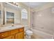Well-maintained bathroom with a bathtub, shower, vanity, and natural light from a window at 353 Meadow Beauty Ter, Sanford, FL 32771