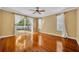 Large bedroom featuring hardwood floors, sliding glass doors to backyard and lots of natural light at 353 Meadow Beauty Ter, Sanford, FL 32771