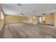 Expansive bonus room with neutral carpet, ceiling fan, and ample natural light from windows at 353 Meadow Beauty Ter, Sanford, FL 32771