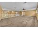 Large, versatile bonus room with a ceiling fan, neutral walls, and views of the surrounding landscape at 353 Meadow Beauty Ter, Sanford, FL 32771