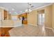 Bright dining area features tile floors, breakfast bar, decorative chandelier, and access to bathroom and kitchen area at 353 Meadow Beauty Ter, Sanford, FL 32771