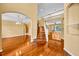Open entryway boasts gleaming hardwood floors and a staircase to the second floor at 353 Meadow Beauty Ter, Sanford, FL 32771