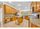 Spacious kitchen boasts granite countertops, center island, and ample storage space at 353 Meadow Beauty Ter, Sanford, FL 32771