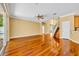 Bright living area with hardwood flooring and large sliding glass doors offering natural light at 353 Meadow Beauty Ter, Sanford, FL 32771