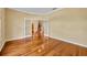 Living room with gleaming wood floors and french doors leading to other parts of the house at 353 Meadow Beauty Ter, Sanford, FL 32771