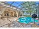 Inviting screened-in pool with brick patio and covered seating area perfect for relaxation at 353 Meadow Beauty Ter, Sanford, FL 32771