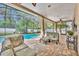 Inviting screened-in pool with brick patio and covered seating area perfect for relaxation at 353 Meadow Beauty Ter, Sanford, FL 32771