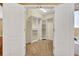 Spacious walk-in closet with ample shelving and carpet flooring, perfect for organized storage at 353 Meadow Beauty Ter, Sanford, FL 32771
