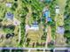 Overhead view of the home's location highlighting a pond and a long driveway at 3550 Kaiser Ave, St Cloud, FL 34772