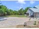 Beautiful backyard with a large patio and grassy area for outdoor enjoyment and entertainment at 3550 Kaiser Ave, St Cloud, FL 34772