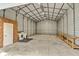 Spacious metal barn with concrete floor, laundry hookups, and ample storage space for various needs at 3550 Kaiser Ave, St Cloud, FL 34772