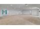 Large carpeted basement with recessed lights, with natural light coming through a window at 3550 Kaiser Ave, St Cloud, FL 34772