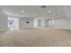Spacious, carpeted basement with recessed lighting and natural light from window at 3550 Kaiser Ave, St Cloud, FL 34772