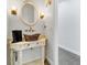 Stylish powder room with a decorative sink, custom faucet, and charming lighting fixtures at 3550 Kaiser Ave, St Cloud, FL 34772