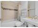 Cozy bathroom featuring tile shower with mosaic accent, modern sink, and neutral tones at 3550 Kaiser Ave, St Cloud, FL 34772