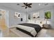 Spacious bedroom with modern decor, large windows, and an en-suite bathroom at 3550 Kaiser Ave, St Cloud, FL 34772