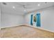 Bright and spacious bedroom with a ceiling fan and window that has blue curtains at 3550 Kaiser Ave, St Cloud, FL 34772