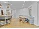 Bright dining nook with a built-in bench, views of the backyard, and an adjacent modern kitchen at 3550 Kaiser Ave, St Cloud, FL 34772