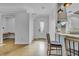 Bright and spacious entryway featuring polished concrete floors and views of the modern kitchen at 3550 Kaiser Ave, St Cloud, FL 34772