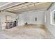 Spacious garage equipped with modern washer/dryer, utility sink, and ample storage space for convenience at 3550 Kaiser Ave, St Cloud, FL 34772