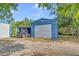 Blue garage, RV parked nearby at 3550 Kaiser Ave, St Cloud, FL 34772