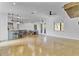 Open-concept living area with concrete floors, a kitchen bar, and a dining nook with backyard views at 3550 Kaiser Ave, St Cloud, FL 34772