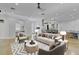 Stylishly decorated living area with concrete floors, an open-concept kitchen, and comfortable seating at 3550 Kaiser Ave, St Cloud, FL 34772