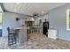 Outdoor kitchen with stainless steel appliances, a bar and neutral colored cabinets at 3550 Kaiser Ave, St Cloud, FL 34772