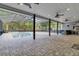 Beautiful screened-in pool with a jacuzzi, outdoor kitchen, and sitting area at 3550 Kaiser Ave, St Cloud, FL 34772