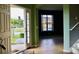 Bright foyer featuring tile floors, arched doorways, and neutral paint colors at 369 James Cir, Lake Alfred, FL 33850
