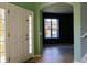 Bright foyer featuring tile floors, arched doorways, neutral paint colors and staircase at 369 James Cir, Lake Alfred, FL 33850