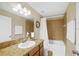 Bathroom with vanity, mirror, and shower-tub combo with tile surround at 380 Carina Cir, Sanford, FL 32773