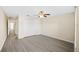 Spacious bedroom with wood-look flooring, ample closet space, and a bright, airy feel at 380 Carina Cir, Sanford, FL 32773