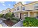 Charming townhouse with manicured landscaping and a welcoming front entrance, perfect for modern living at 380 Carina Cir, Sanford, FL 32773