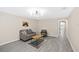 Bright living room showcasing modern decor, wood-look flooring, and ample space for comfortable seating at 380 Carina Cir, Sanford, FL 32773