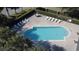 Community pool with lounge chairs and umbrellas at 380 Carina Cir, Sanford, FL 32773