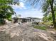 Spacious backyard with screened-in patio, ready for entertaining and outdoor enjoyment at 4025 Luan Dr, Orlando, FL 32808