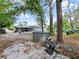 The backyard has mature trees, a shed, and a partially covered patio area at 4025 Luan Dr, Orlando, FL 32808
