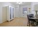 Bright bedroom with laminate flooring, featuring a closet and natural light from the window at 4025 Luan Dr, Orlando, FL 32808