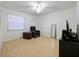 Cozy bedroom featuring laminate flooring, a comfortable chair, and a full-length mirror at 4025 Luan Dr, Orlando, FL 32808