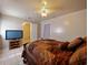 Comfortable bedroom features a ceiling fan and a bed, perfect for relaxing and unwinding at 4025 Luan Dr, Orlando, FL 32808
