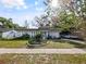 Charming single-story home with mature landscaping and a well-manicured lawn at 4025 Luan Dr, Orlando, FL 32808