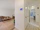 Hallway with tiled floors leading into the living room and bedroom at 4025 Luan Dr, Orlando, FL 32808