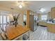 Open concept kitchen featuring tile floors, stainless steel appliances, and a view to the living room at 4025 Luan Dr, Orlando, FL 32808