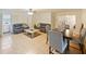 Bright living room with tile flooring, comfortable seating, and natural light creating a welcoming space at 4025 Luan Dr, Orlando, FL 32808